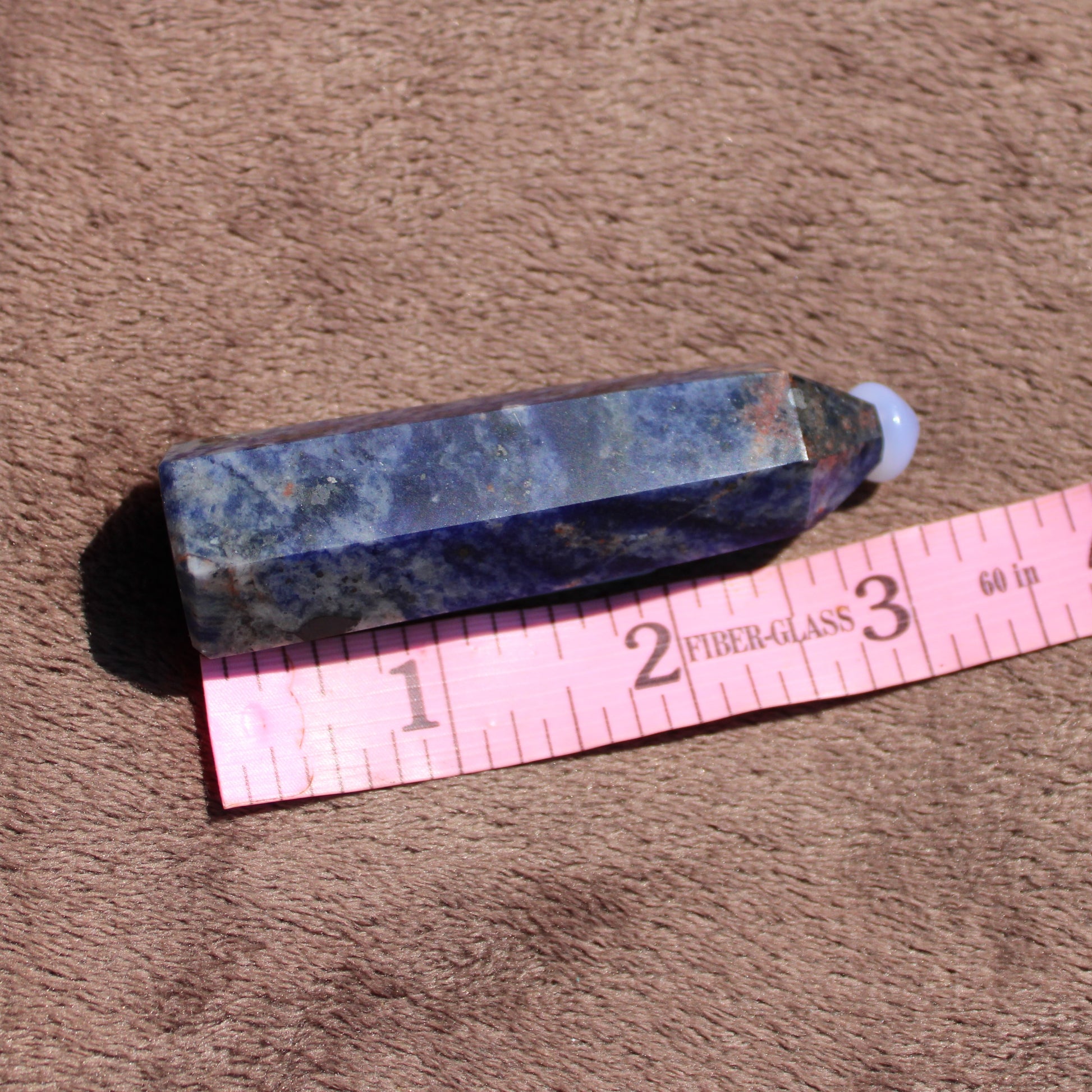 Sodalite tower crystal with a unique blue hue, ideal for decorative purposes or meditation