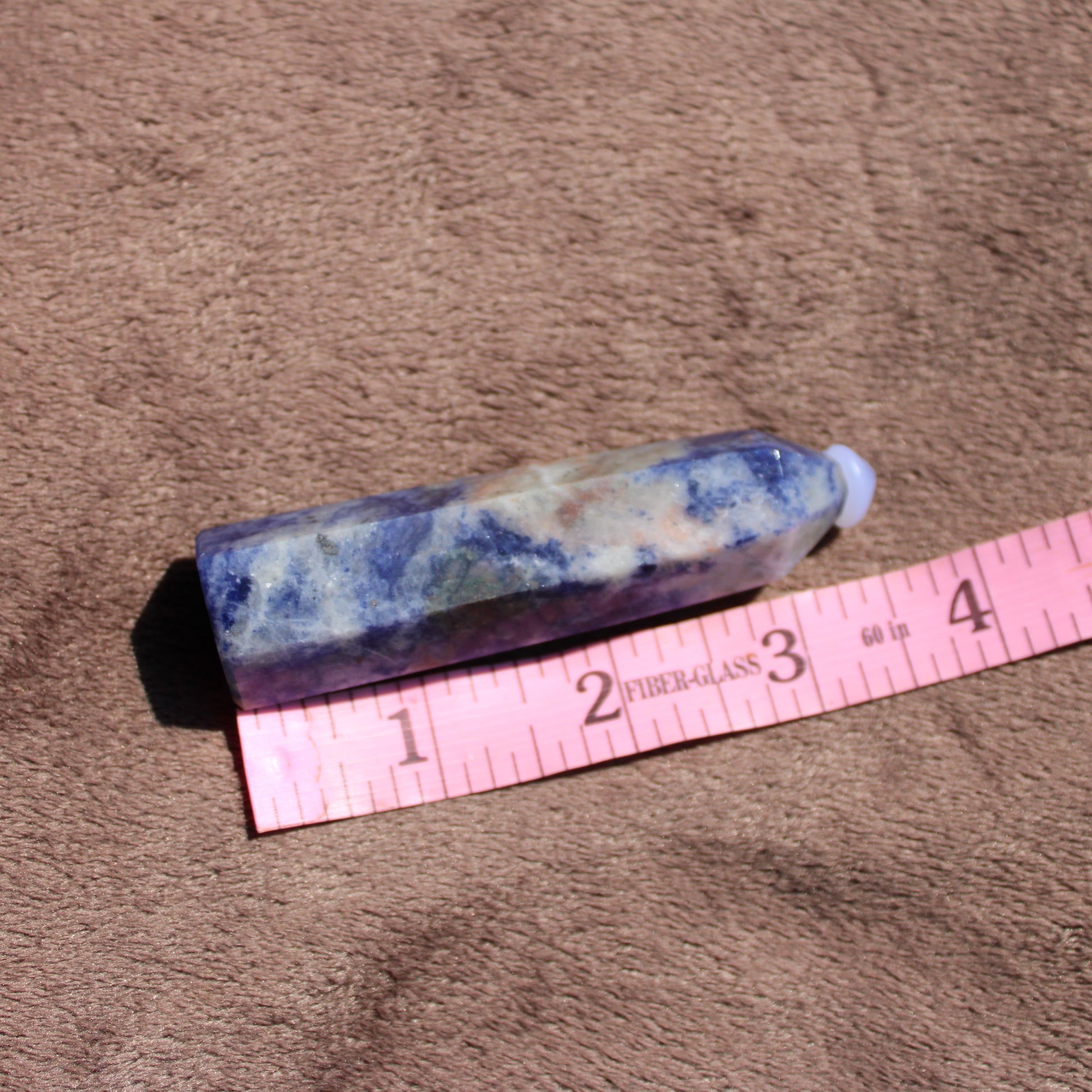 Unique Sodalite tower crystal with blue and white patterns for decoration and healing purposes