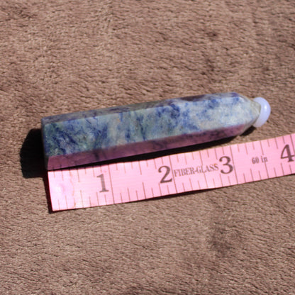 Sodalite tower crystal showcasing rich blue and purple hues with a smooth finish for decorative use