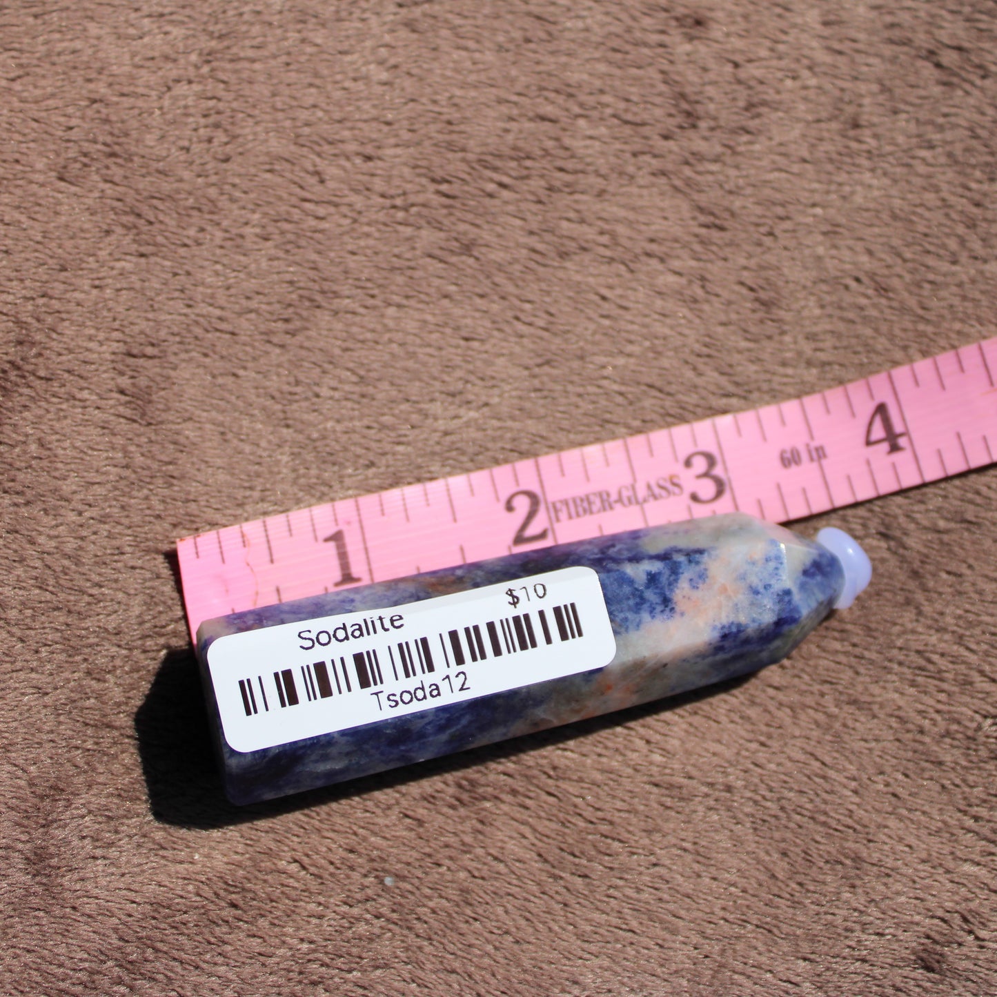 Sodalite tower from Different Branches LLC with natural blue and white patterns on the crystal surface