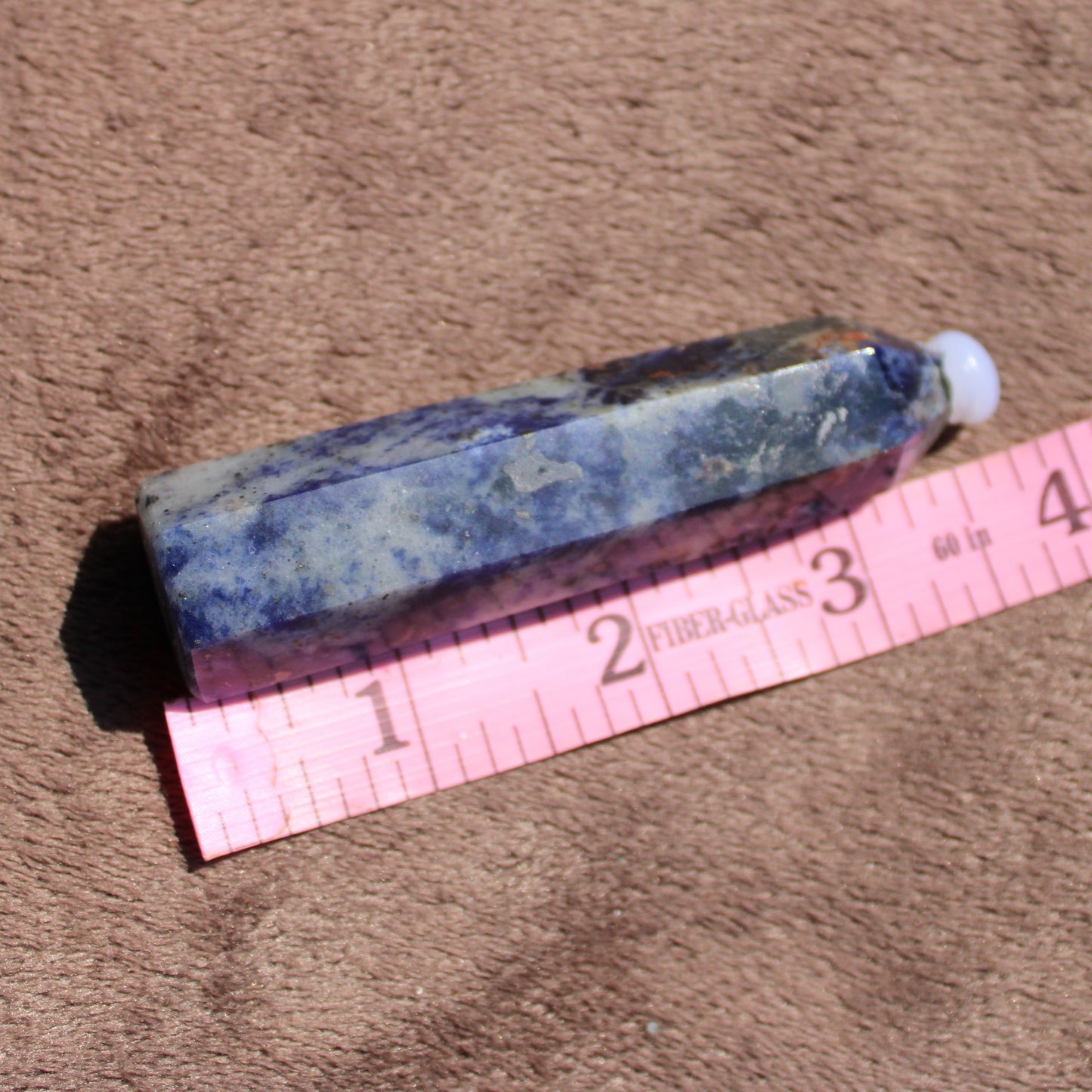 Sodalite tower crystal with natural blue hues, ideal for meditation and healing practices