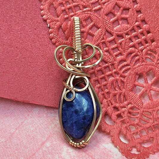 Handcrafted Sodalite Pendant in Copper Wire Wrap with Elegant Design for Unique Jewelry Lovers