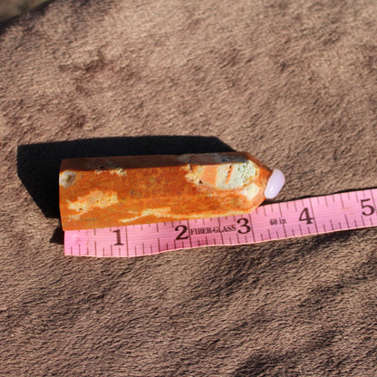 Sunstone tower with warm orange hues, perfect for crystal healing and decoration
