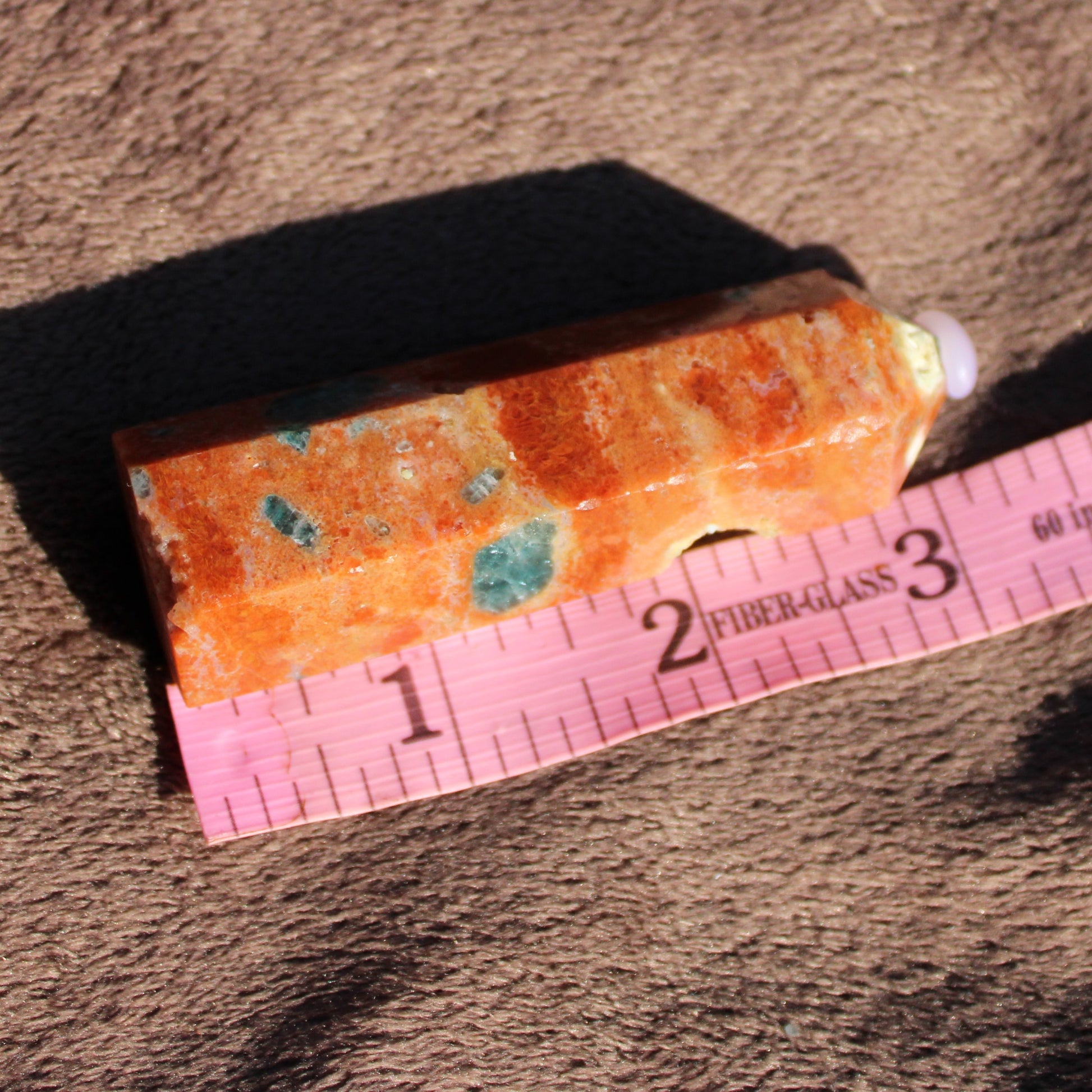 Natural Sunstone tower with orange and green flecks, perfect for crystal healing and decor