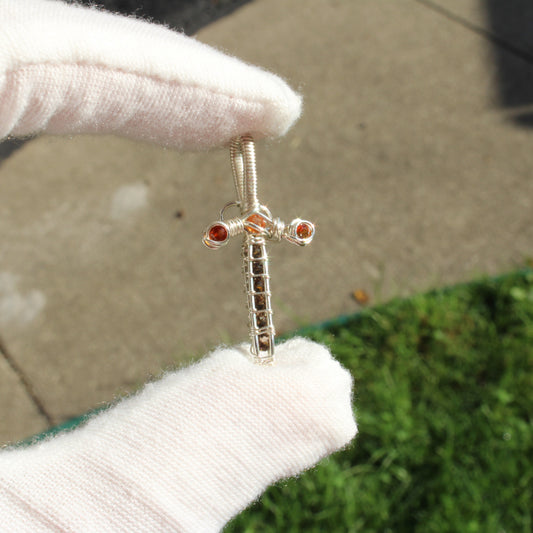 Sterling silver sword pendant adorned with smokey quartz and garnet gemstones