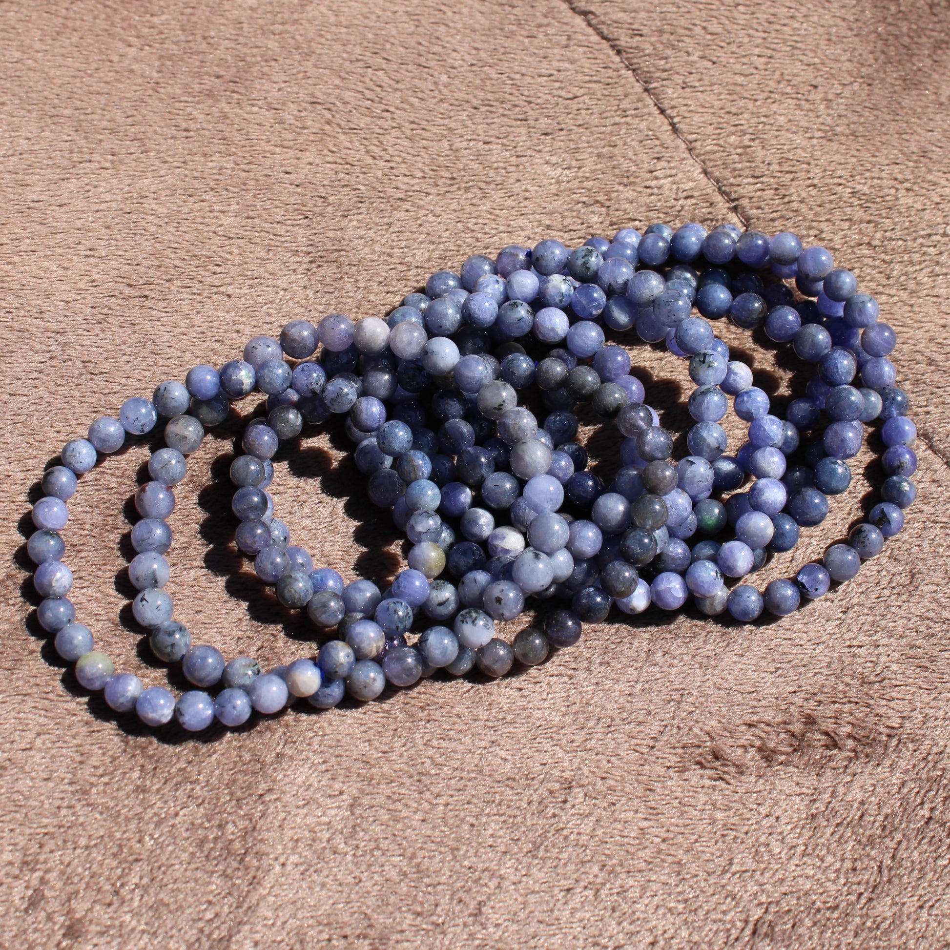 Elegant Tanzanite Bracelet featuring round beads in various shades of blue, perfect for everyday wear