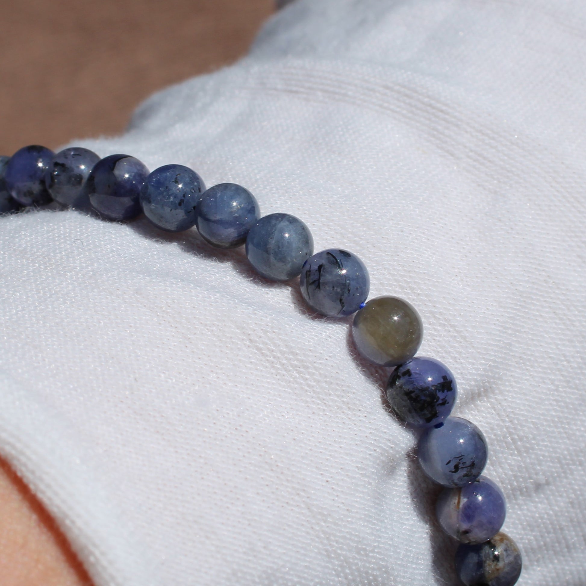 Elegant Tanzanite Bracelet made with smooth beads, showcasing rich blue hues and natural variations