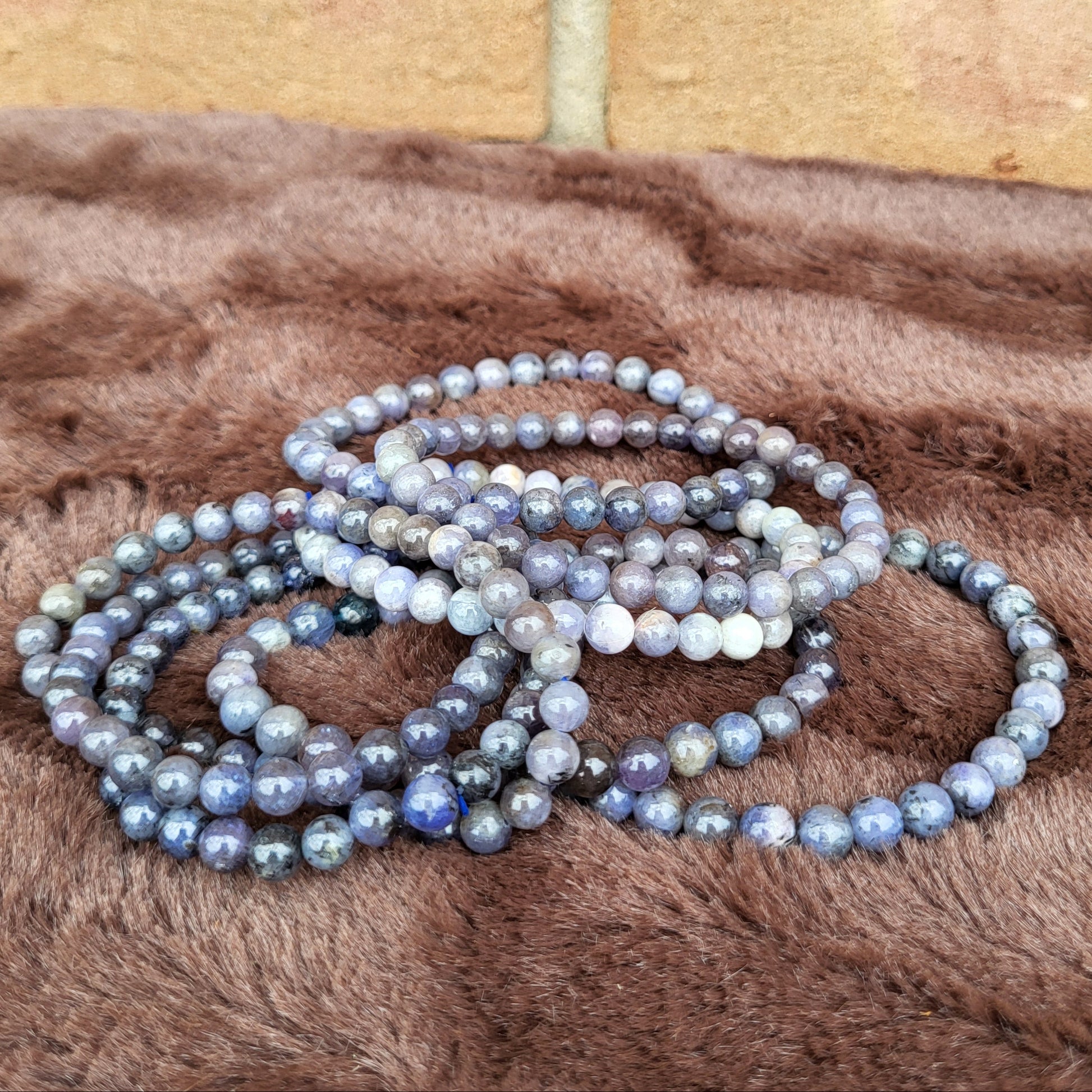 Tanzanite bracelet stack showcasing beautiful gemstones in various shades for elegant accessories