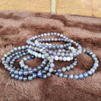 Tanzanite bracelet stack showcasing beautiful gemstones in various shades for elegant accessories