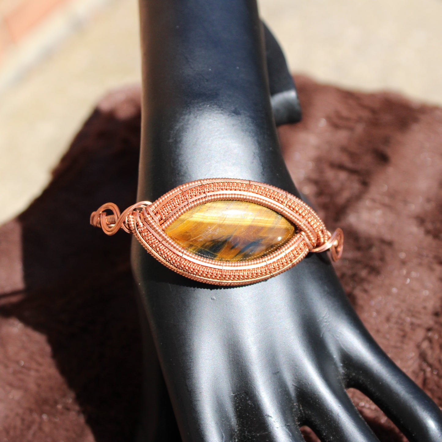 Tiger Eye Bracelet with a unique copper wire design showcasing a stunning oval stone