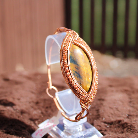 Tiger Eye Bracelet in a unique wire wrap design, showcasing the stone's natural beauty and luster