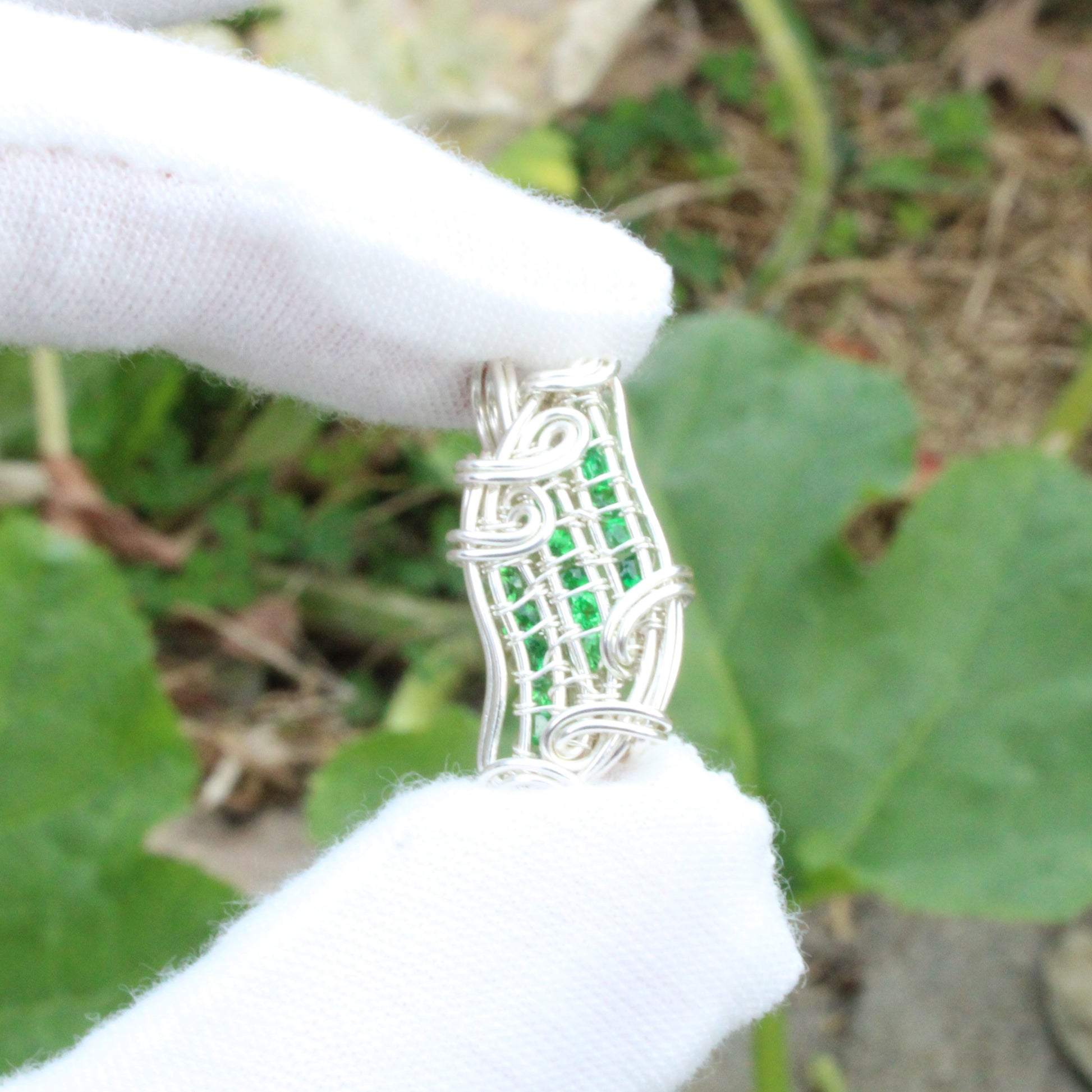 Handcrafted Tsavorite Sterling silver Pendant with intricate wire craftsmanship showcasing vibrant green stones