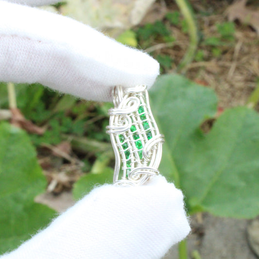 Handcrafted Tsavorite Sterling silver Pendant with intricate wire craftsmanship showcasing vibrant green stones