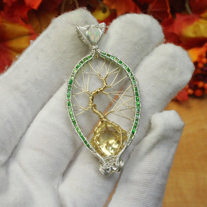 Tsavorite tree of life pendant with intricate gold wire design and a central gemstone