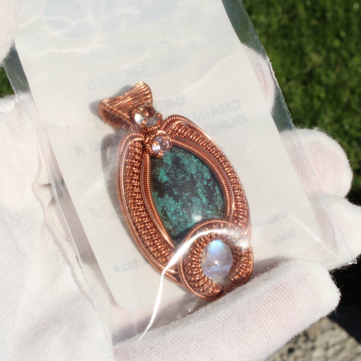 Turquoise copper pendant featuring a copper wire design with a unique turquoise stone