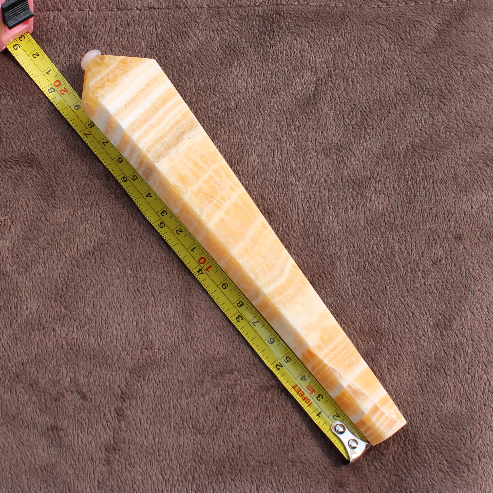Honey Calcite Wand measuring approximately 9 inches with smooth polished surface from Different Branches LLC